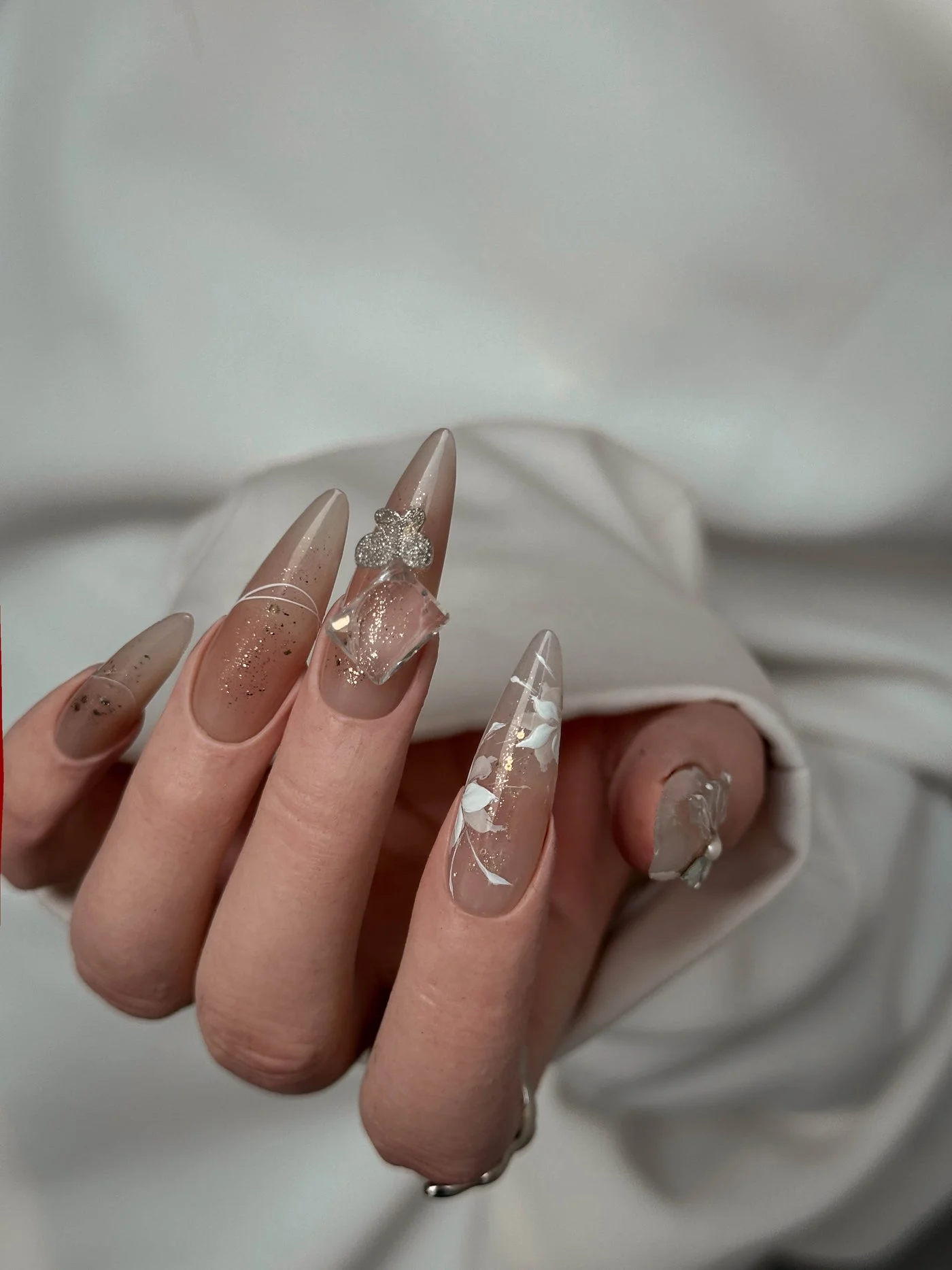 Hers Luxe nail art — glazed almond set with crystal charm