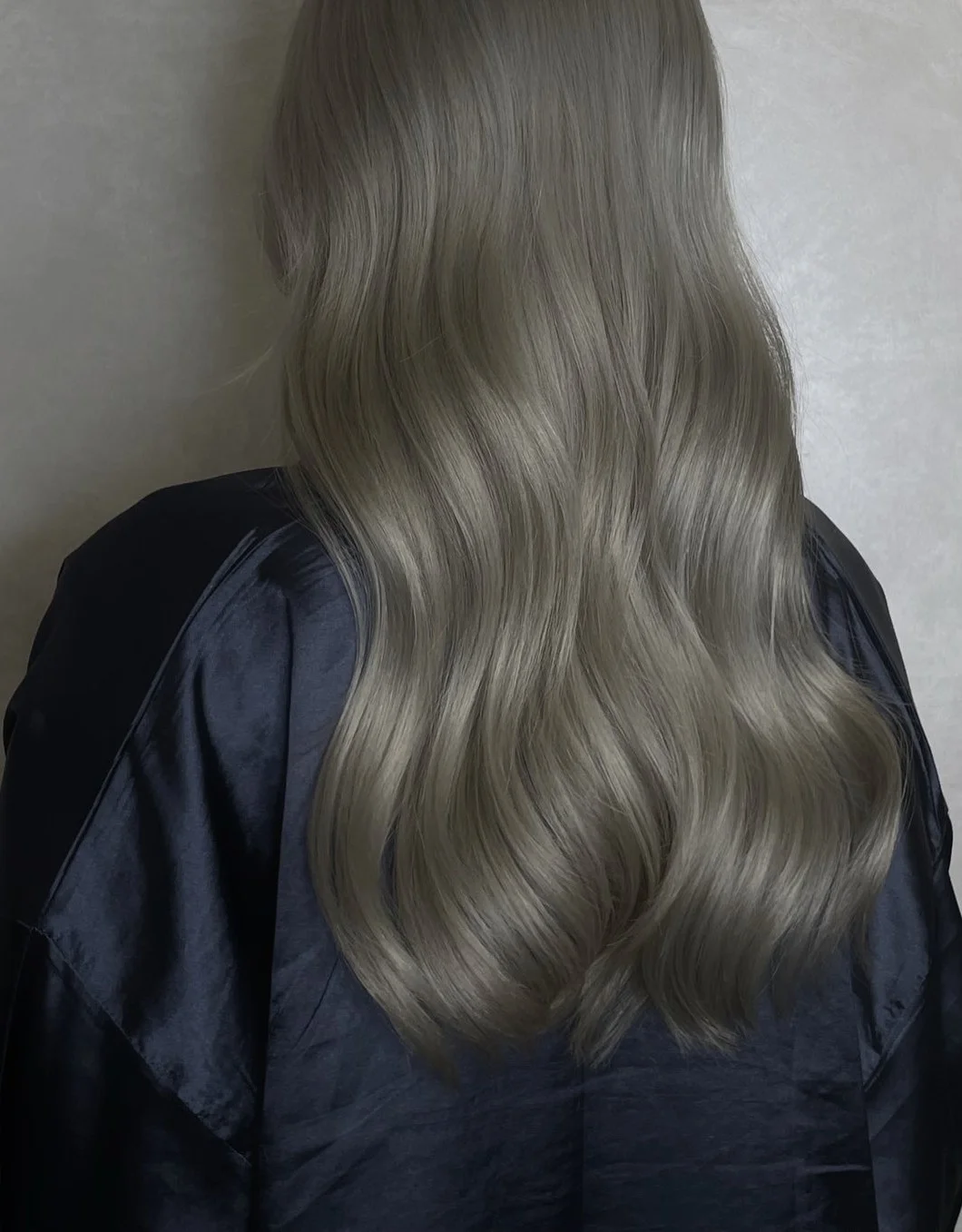 Hers Luxe hair result — soft ash-blonde waves